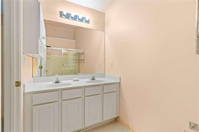 bathroom featuring tile patterned floors and dual vanity