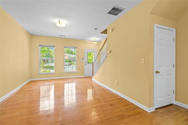 unfurnished room featuring light hardwood / wood-style flooring