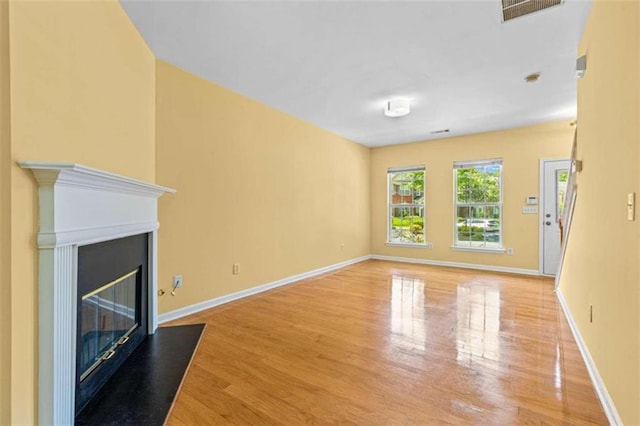 unfurnished living room featuring light hardwood / wood-style flooring