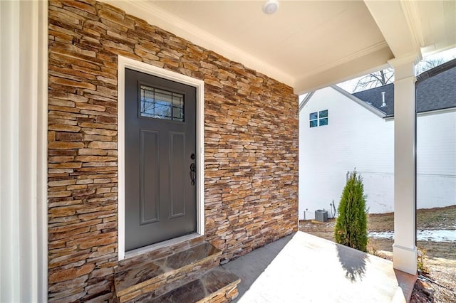 doorway to property with central AC unit