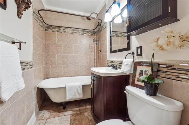 full bathroom featuring tile walls, toilet, and vanity