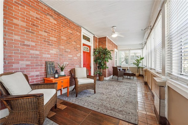 sunroom with ceiling fan