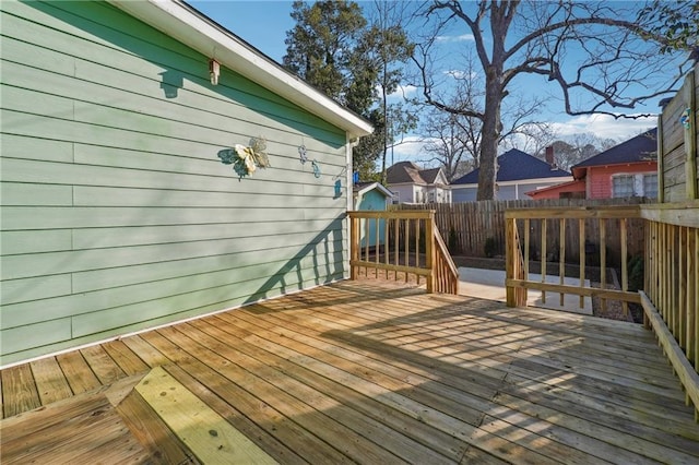 wooden deck featuring fence