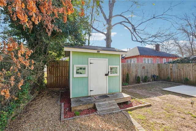 view of shed with a fenced backyard