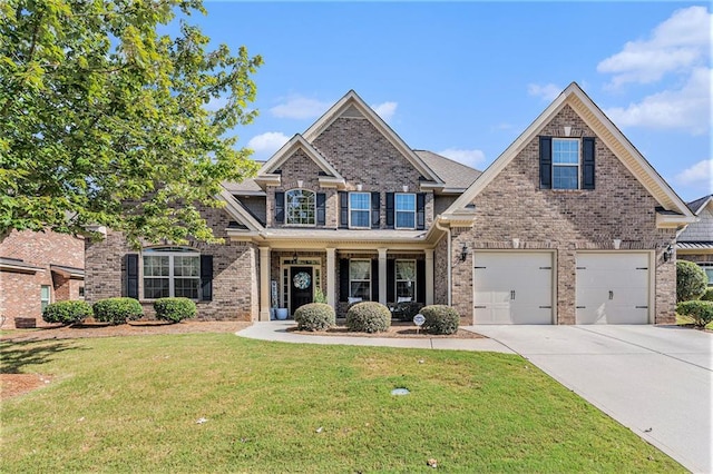 craftsman-style home with a garage and a front lawn