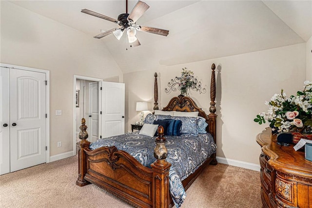 carpeted bedroom featuring ceiling fan, a closet, and vaulted ceiling