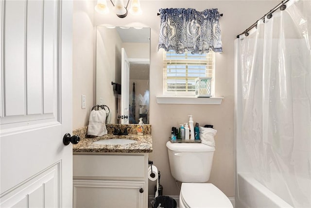 full bathroom featuring vanity, toilet, and shower / tub combo