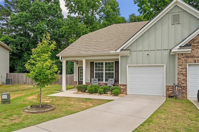 560 Vandenburg Dr, Villa Rica, GA 30180 - view of front of house featuring board and batten siding, brick siding, concrete driveway, roof with shingles, and a garage