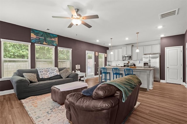 560 Vandenburg Dr, Villa Rica, GA 30180 - living area featuring ceiling fan, wood finished floors, and recessed lighting