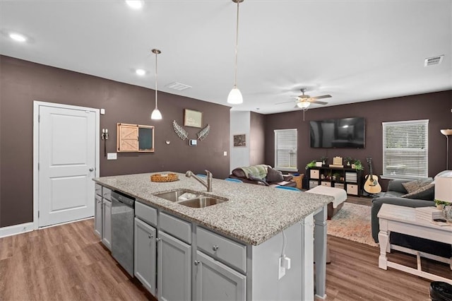 560 Vandenburg Dr, Villa Rica, GA 30180 - kitchen featuring dishwasher, open floor plan, wood finished floors, ceiling fan, and recessed lighting