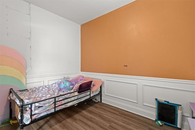 560 Vandenburg Dr, Villa Rica, GA 30180 - living area with wood finished floors, a wainscoted wall, and a decorative wall