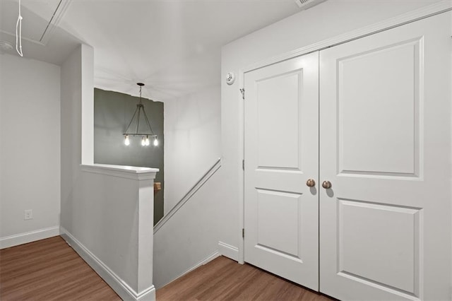 560 Vandenburg Dr, Villa Rica, GA 30180 - hallway featuring attic access, an upstairs landing, and wood finished floors
