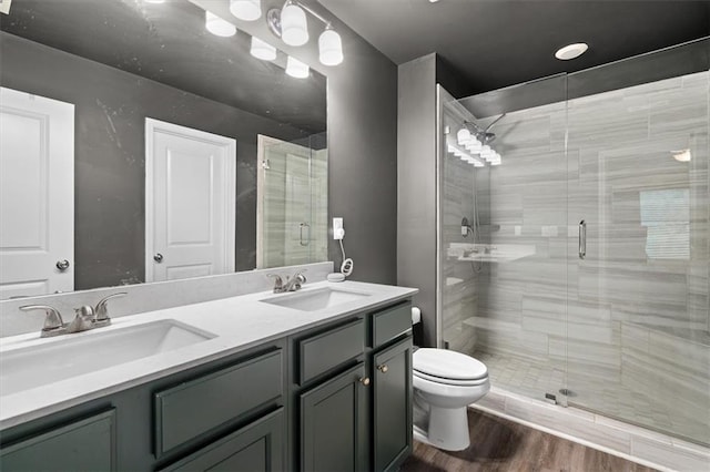 560 Vandenburg Dr, Villa Rica, GA 30180 - bathroom with double vanity, a shower stall, and wood finished floors