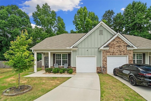 560 Vandenburg Dr, Villa Rica, GA 30180 - view of front of house with board and batten siding, concrete driveway, a garage, brick siding, and a shingled roof