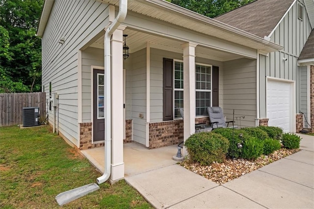 560 Vandenburg Dr, Villa Rica, GA 30180 - entrance to property with a porch, a garage, board and batten siding, brick siding, and a shingled roof