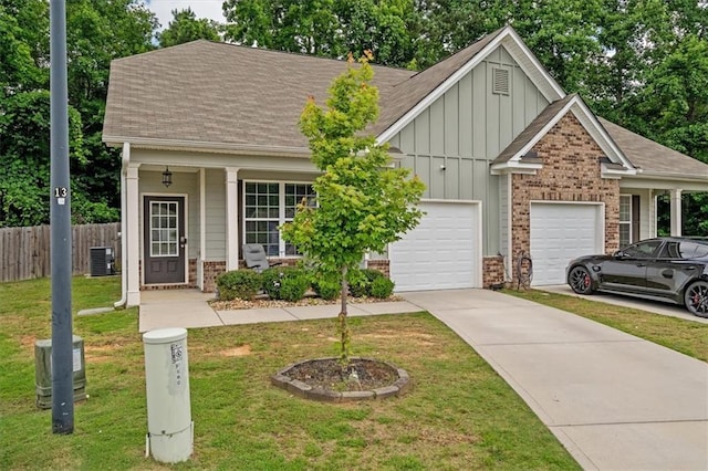560 Vandenburg Dr, Villa Rica, GA 30180 - view of front of house featuring board and batten siding, brick siding, a garage, concrete driveway, and a shingled roof