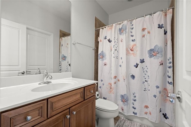 full bath featuring toilet and vanity
