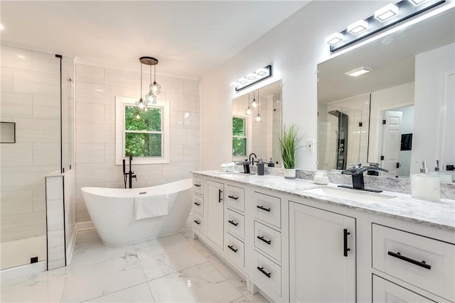 bathroom featuring shower with separate bathtub, tile walls, and vanity