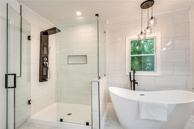 bathroom with tile walls and plus walk in shower