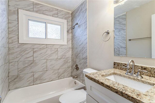 full bathroom with vanity, toilet, and tiled shower / bath combo