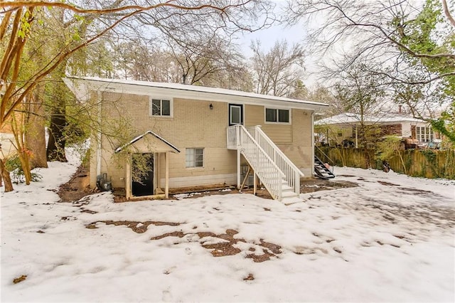 view of snow covered house