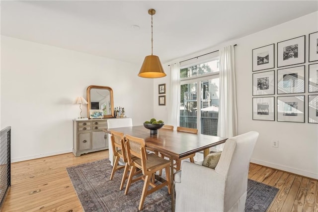1290 Nervi Mews NW, Atlanta, GA 30318 - dining room featuring light wood-type flooring and baseboards