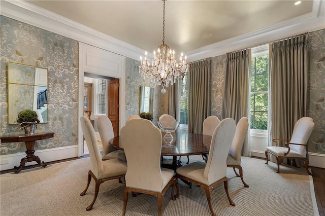 dining space with a notable chandelier, wallpapered walls, baseboards, and ornamental molding