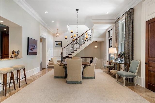 carpeted dining area featuring crown molding and a notable chandelier