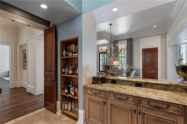 bar featuring a chandelier, recessed lighting, light wood-style flooring, and crown molding