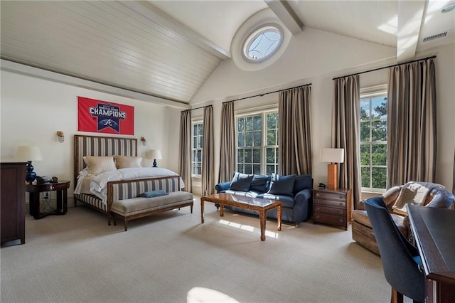 carpeted bedroom with visible vents, multiple windows, and vaulted ceiling with beams