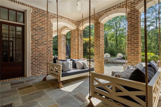 view of patio / terrace featuring area for grilling, ceiling fan, and outdoor lounge area