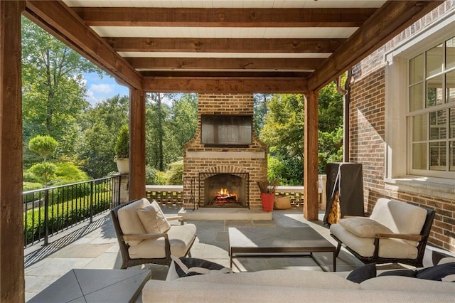 view of patio / terrace featuring an outdoor living space with a fireplace