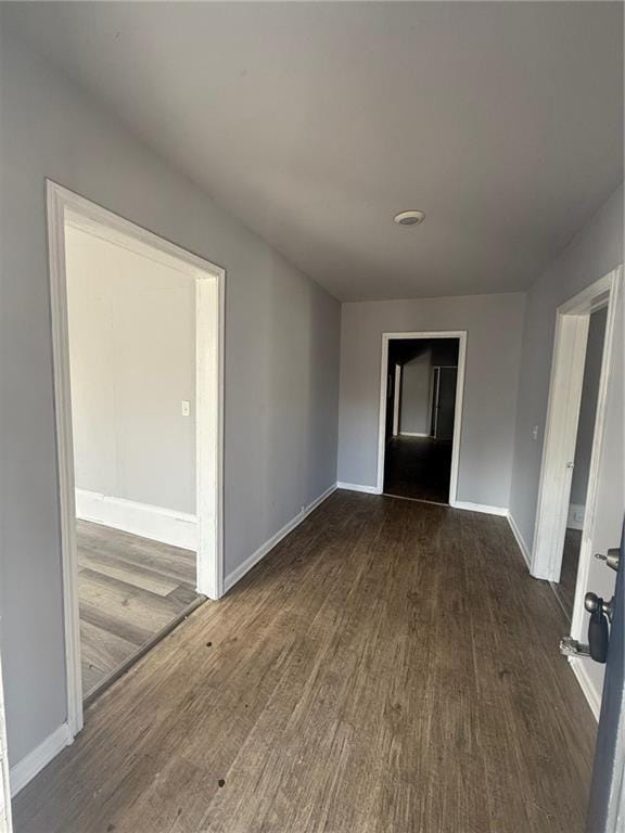 interior space with dark hardwood / wood-style flooring