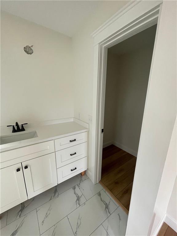 446 Brown Bridge Rd, Chatsworth, GA 30705 - bathroom with vanity, baseboards, and marble finish flooring