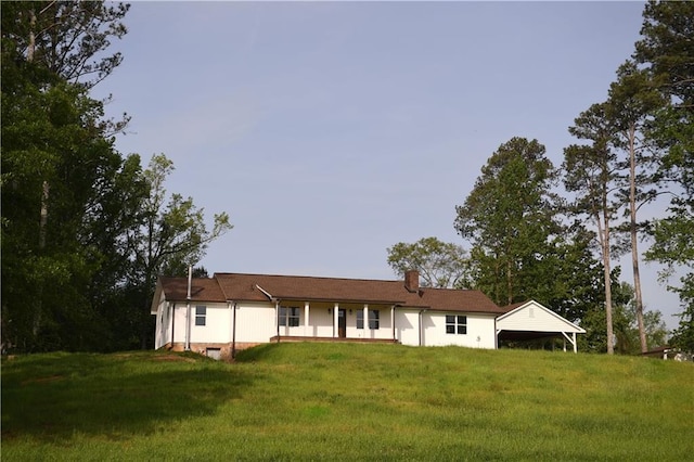 446 Brown Bridge Rd, Chatsworth, GA 30705 - view of front of house with a front lawn and a chimney