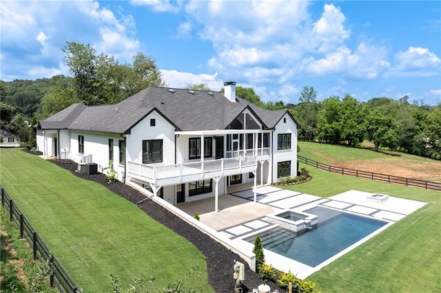 5651 Old Wilkie Rd, Gainesville, GA 30506 - back of house featuring a patio area, stucco siding, a fenced backyard, a pool with connected hot tub, and a shingled roof