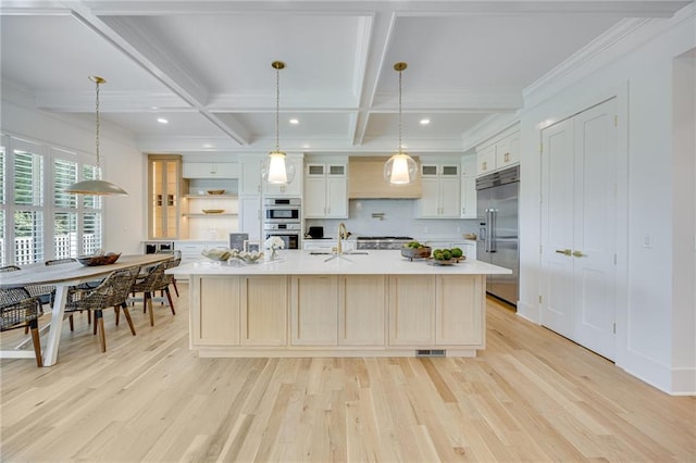 5651 Old Wilkie Rd, Gainesville, GA 30506 - kitchen featuring stainless steel appliances, coffered ceiling, light countertops, light wood-style floors, and a spacious island