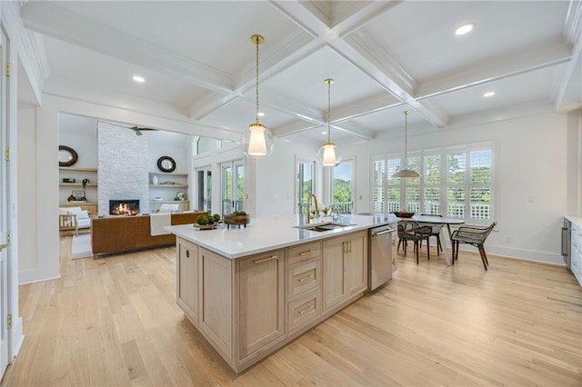 5651 Old Wilkie Rd, Gainesville, GA 30506 - kitchen featuring dishwasher, light wood-type flooring, a stone fireplace, light countertops, and beam ceiling