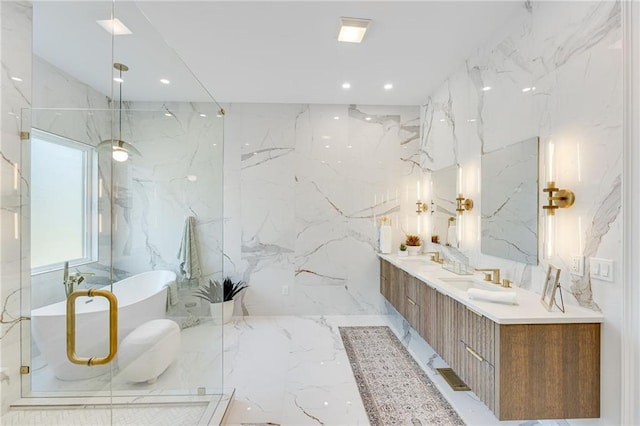 5651 Old Wilkie Rd, Gainesville, GA 30506 - bathroom with marble tiled flooring, stone wall, a soaking tub, double vanity, and recessed lighting