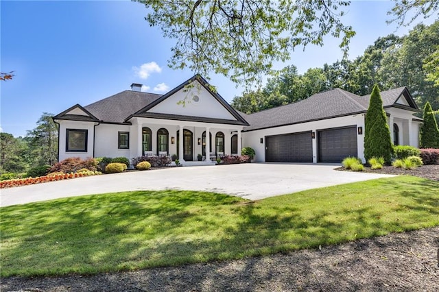 5651 Old Wilkie Rd, Gainesville, GA 30506 - view of front facade featuring an attached garage, curved driveway, covered porch, a front yard, and stucco siding