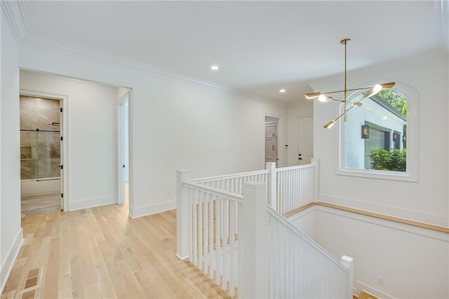 5651 Old Wilkie Rd, Gainesville, GA 30506 - hall with an upstairs landing, a chandelier, light wood-style flooring, ornamental molding, and recessed lighting