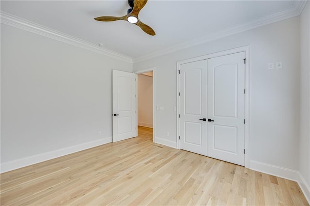 5651 Old Wilkie Rd, Gainesville, GA 30506 - unfurnished bedroom featuring light wood-type flooring, ornamental molding, a closet, and ceiling fan