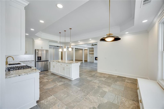 5651 Old Wilkie Rd, Gainesville, GA 30506 - kitchen featuring stainless steel fridge, a tray ceiling, ornamental molding, stone tile floors, and white cabinetry
