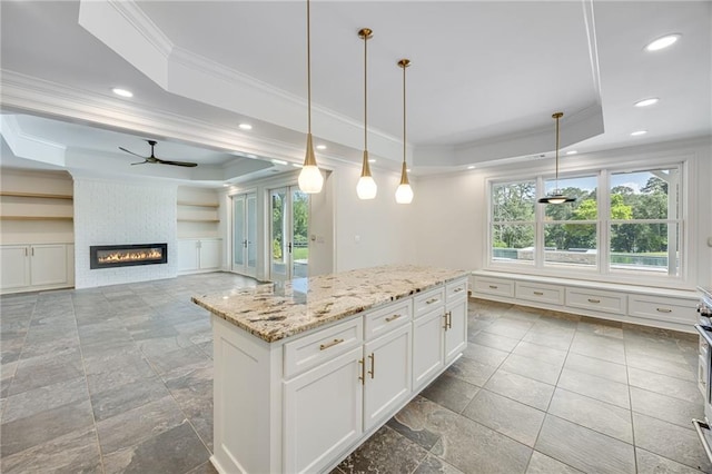 5651 Old Wilkie Rd, Gainesville, GA 30506 - kitchen featuring a raised ceiling, ornamental molding, plenty of natural light, ceiling fan, and recessed lighting