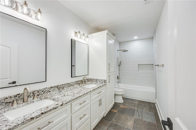 5651 Old Wilkie Rd, Gainesville, GA 30506 - bathroom featuring double vanity, stone tile floors, recessed lighting, and shower / washtub combination