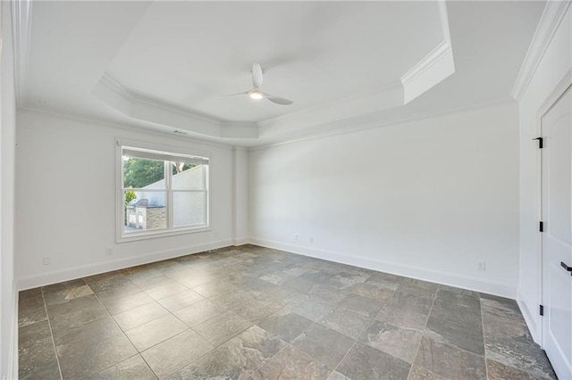 5651 Old Wilkie Rd, Gainesville, GA 30506 - spare room featuring a raised ceiling, ornamental molding, a ceiling fan, and stone tile flooring