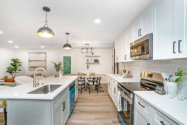 1091 Pine St, Conyers, GA 30012 - kitchen featuring stainless steel appliances, light countertops, recessed lighting, and tasteful backsplash