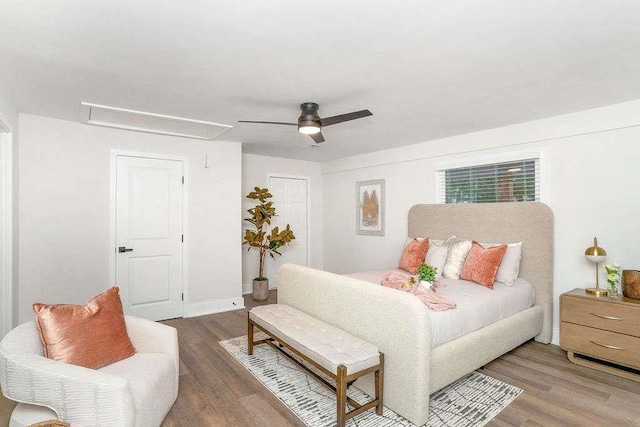 1091 Pine St, Conyers, GA 30012 - bedroom featuring attic access, wood finished floors, and a ceiling fan
