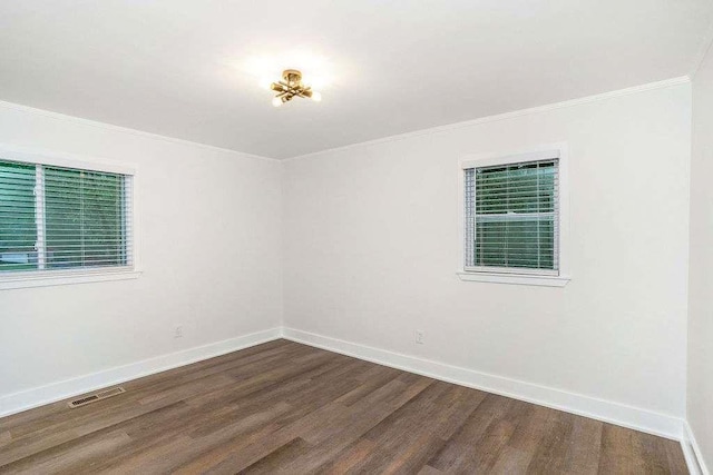 1091 Pine St, Conyers, GA 30012 - unfurnished room featuring dark wood-type flooring and crown molding