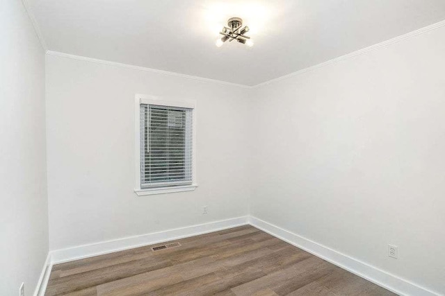 1091 Pine St, Conyers, GA 30012 - unfurnished room with ornamental molding and dark wood-type flooring